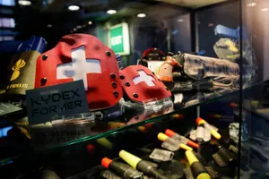 How can Switzerland's obsession with guns be explained?